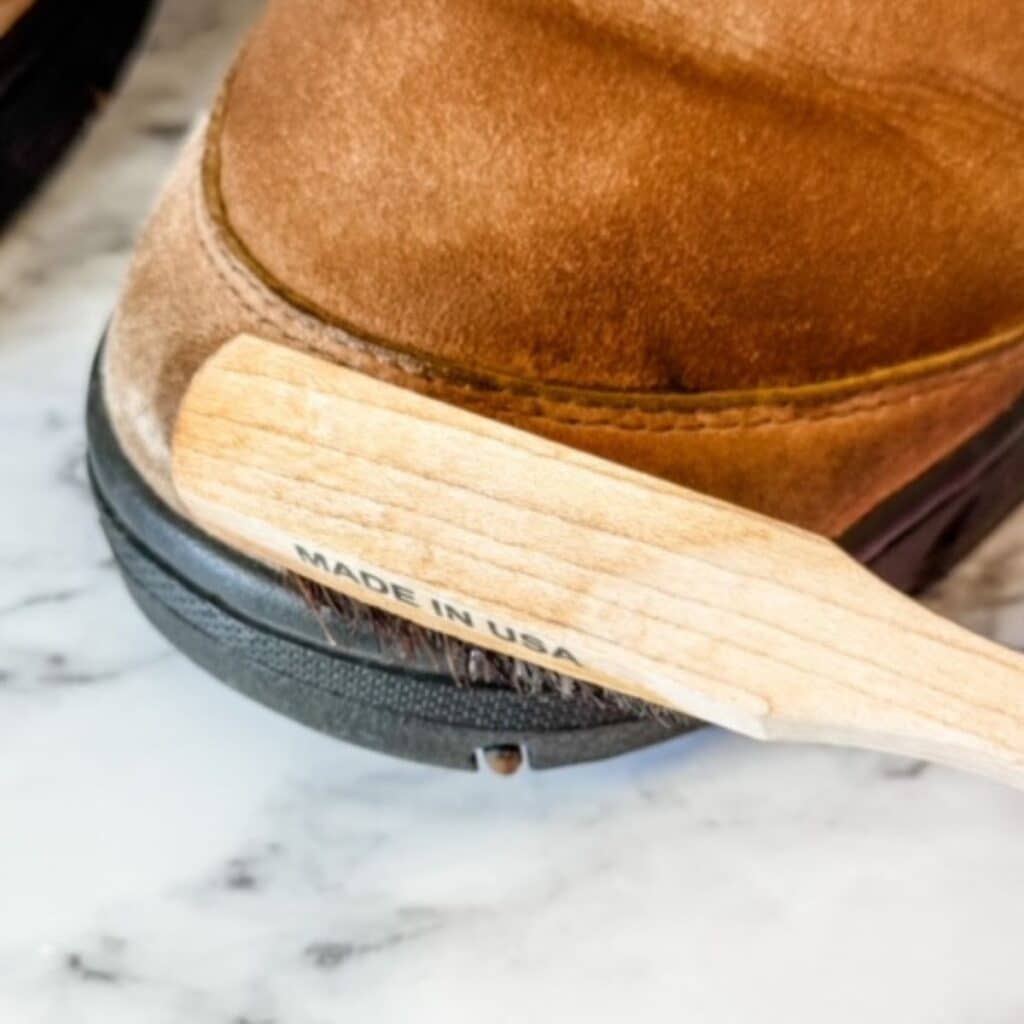 spot scrubbing ugg boots with a laundry brush