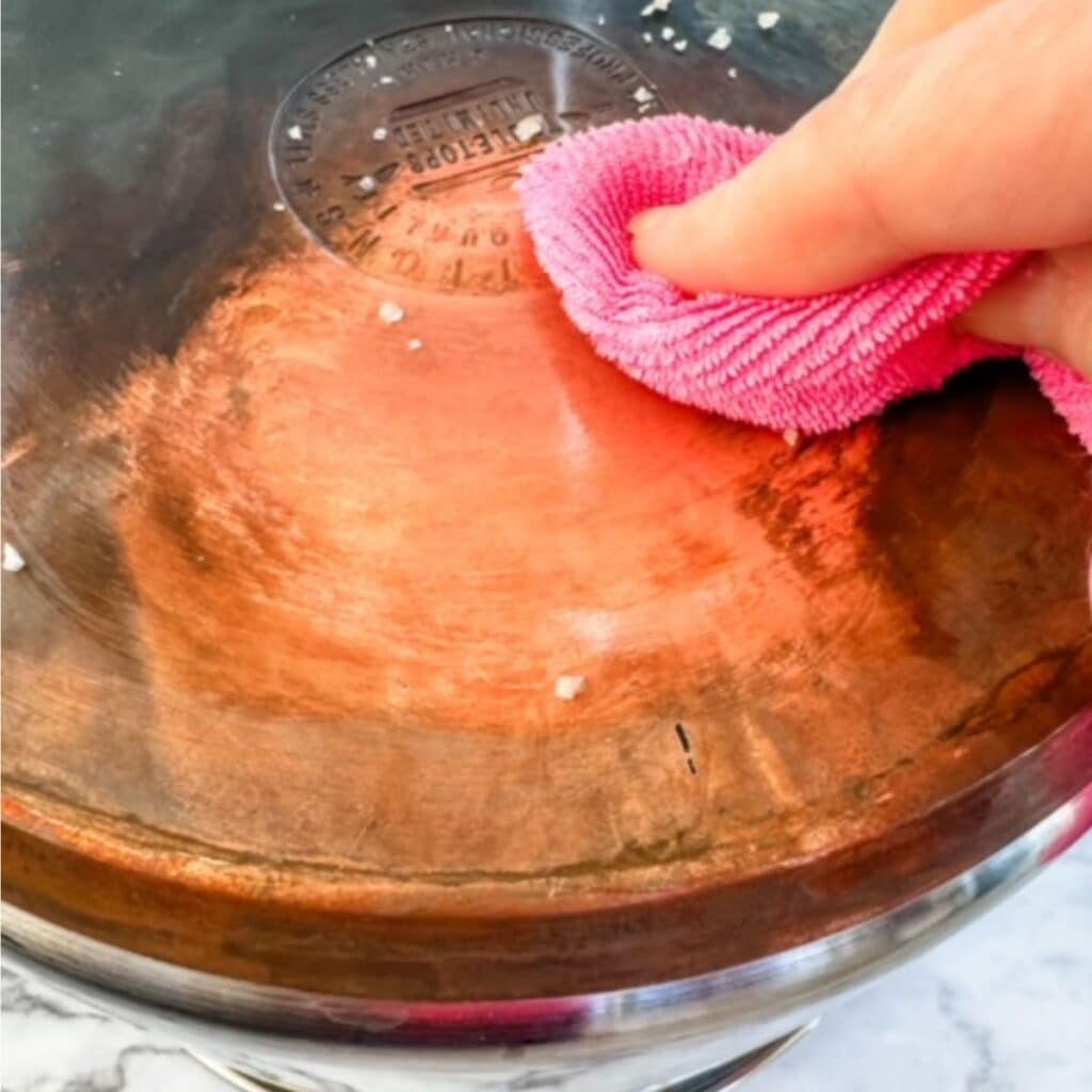 lemon juice and salt on a copper pot