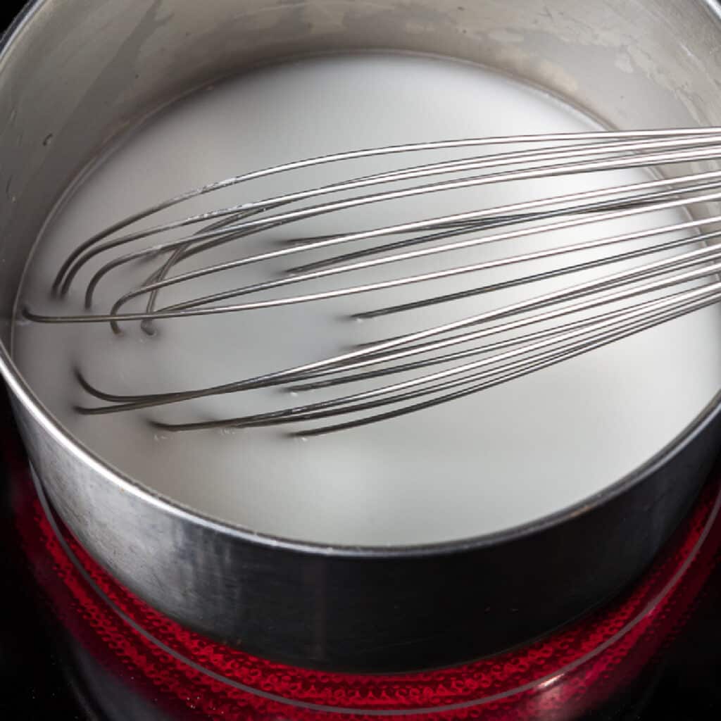 mixing water and cornstarch to make bleach pen