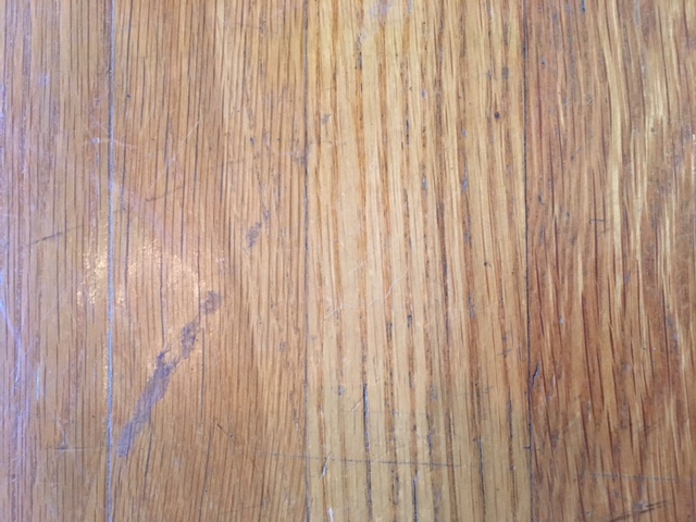 removing scuffs with a tennis ball on wooden floors