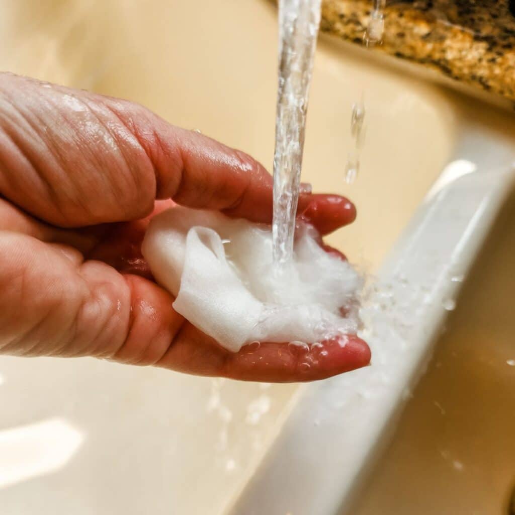 adding water to a paper towel.