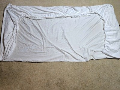 tip to fold a fitted sheet