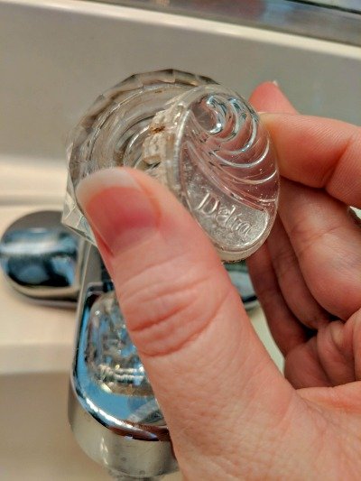 removing end cap from faucet.