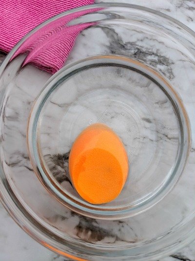 soaking beauty blender in water