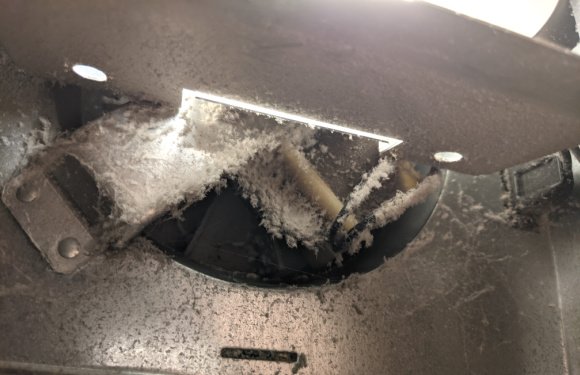 exhaust fan in bathroom covered in dust