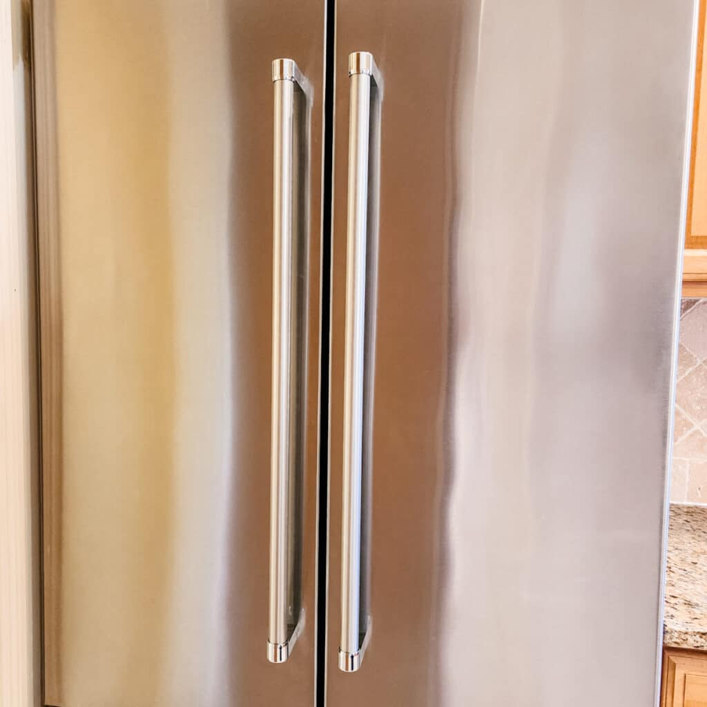 A clean stainless steel refrigerator after using a DIY cleaning solution.