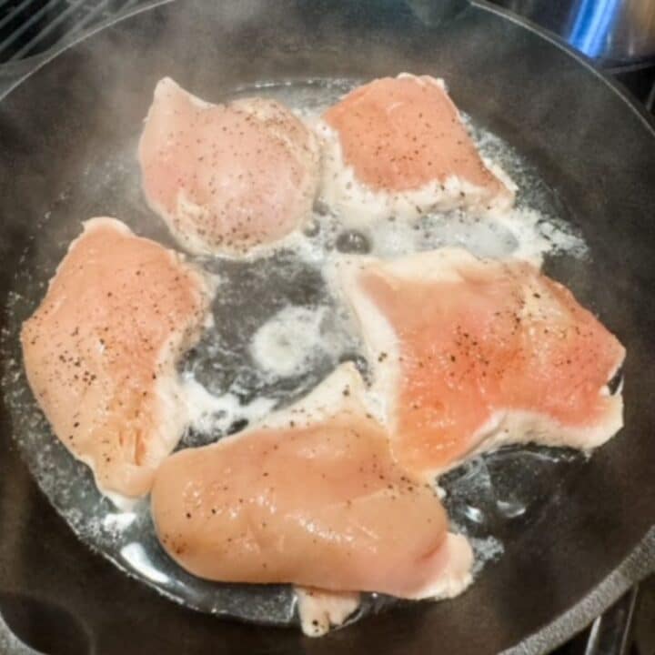 chicken breasts cooking on the stove